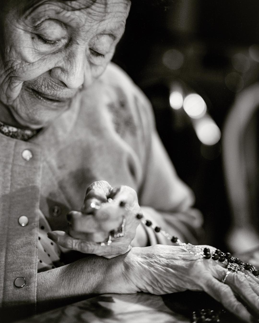Close view of practiced hands working with a small object